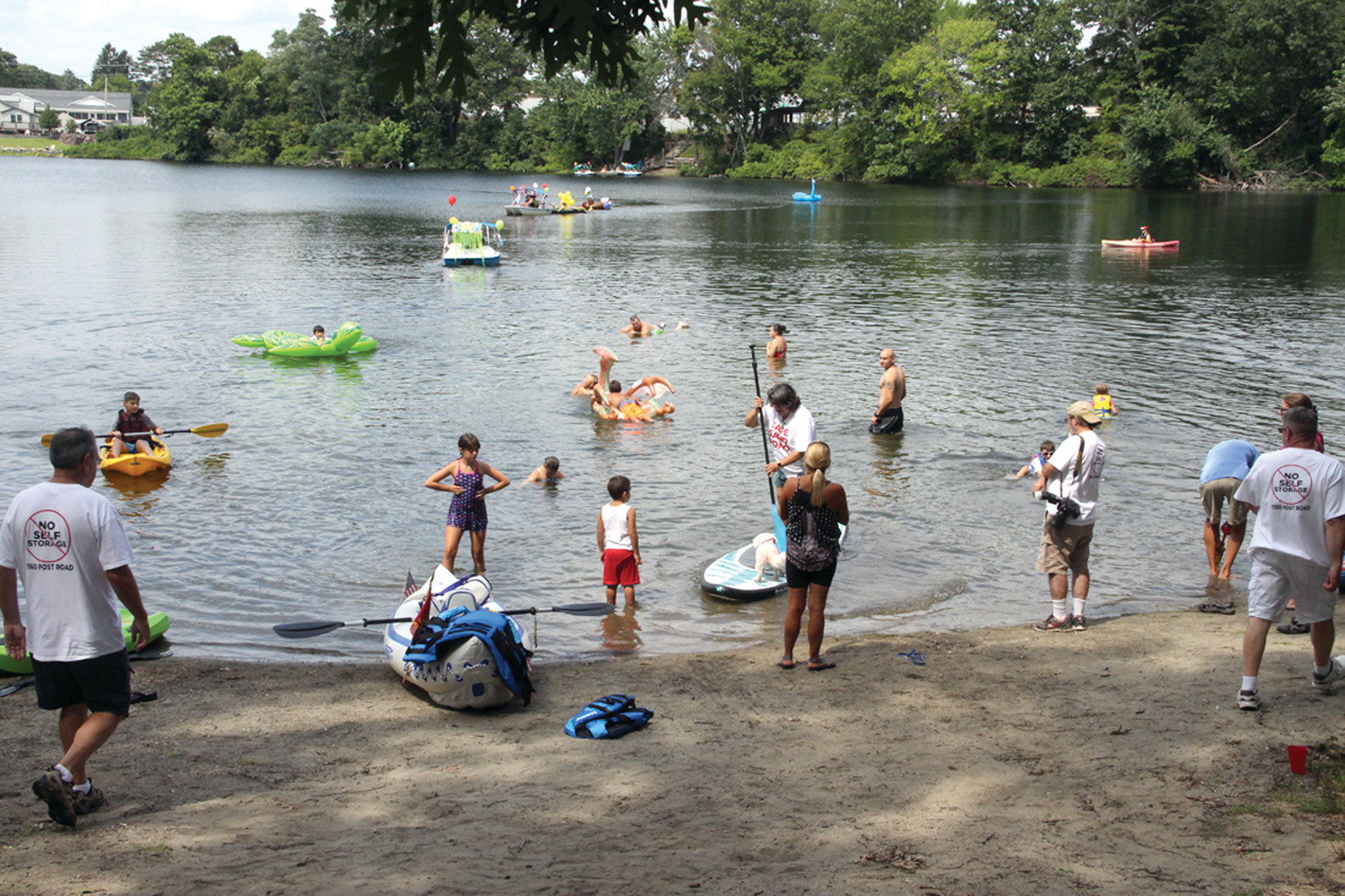 POND PLAY: The water was a perfect temperature Saturday as area residents gathered both on the water and the beach for the Sand Pond Palozza in opposition to a proposal to build a 630-unit self storage-unit at Pond Plaza on Post Road.